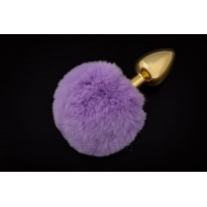 Маленькая золотистая пробка с пушистым фиолетовым хвостиком